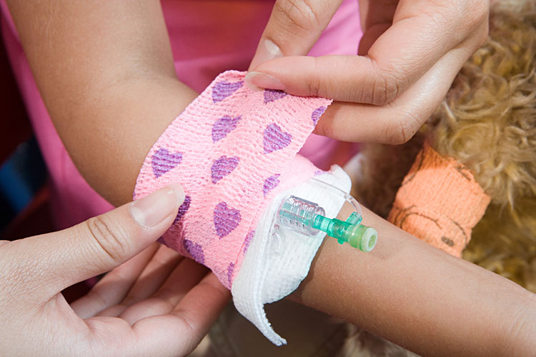 school nurse helping little girl
