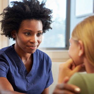nurse comforting patient