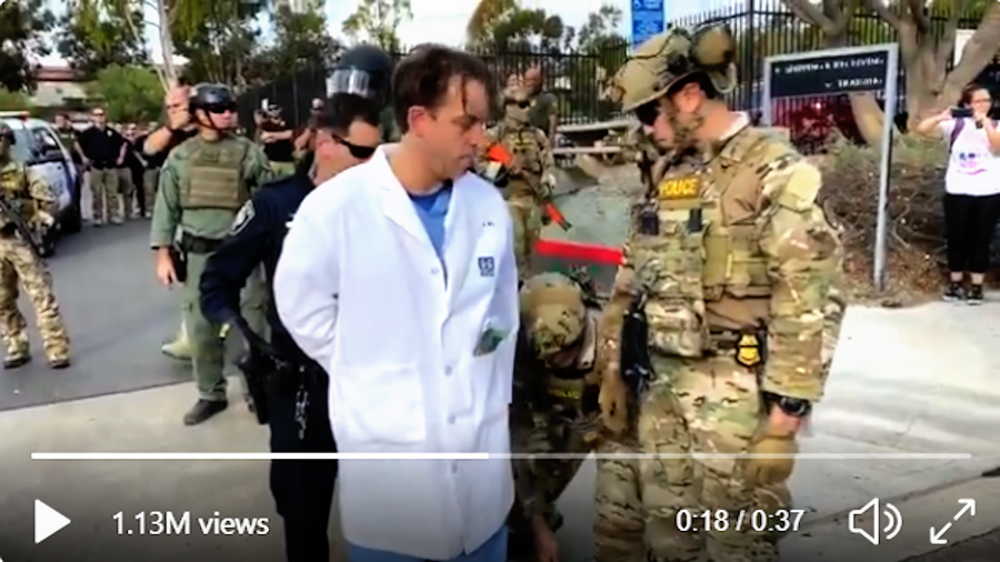 Doctor arrested during border flu shot protest