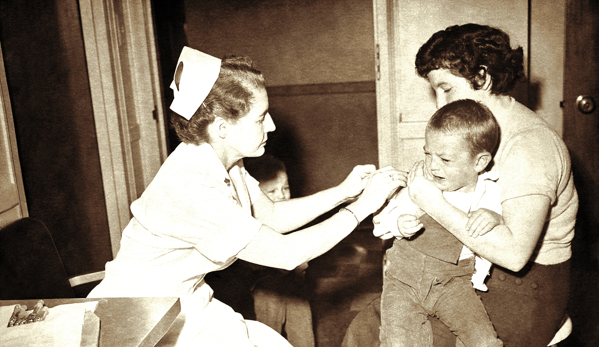Child receives smallpox vaccination.