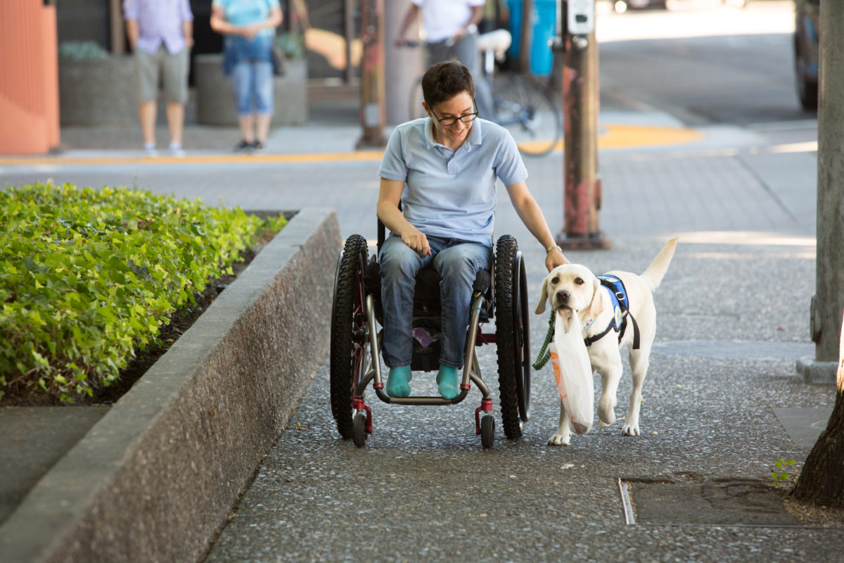 Wallis Brozman and her service dog Renata Photo by Chris Kitteredge Photography