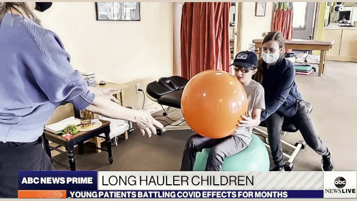 Pediatric nurses work with a Covid child long hauler.