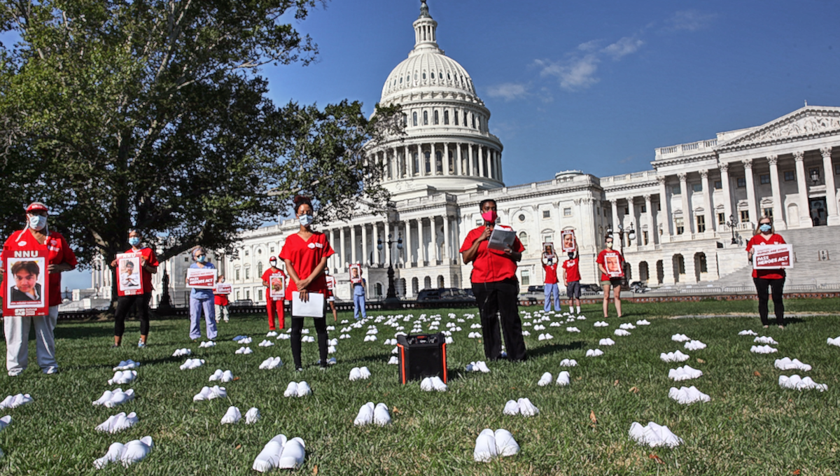 National Nurses United honored nurses fallen to Covid-19 by setting pairs of white nursing shoes on the Capitol lawn.