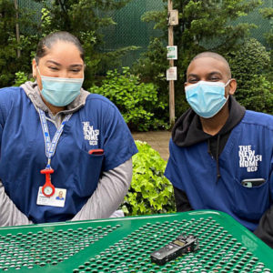 Jasmine De Moya (left) and Kennedy Johnson volunteered at a New Jewish Home senior living facility in New York as part of a program where they also receive training for health jobs, college prep and career coaching.