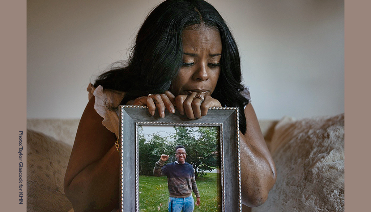 Rafiah Maxie with a portrait of her son Jamal Clay, who died by suicide in 2020.