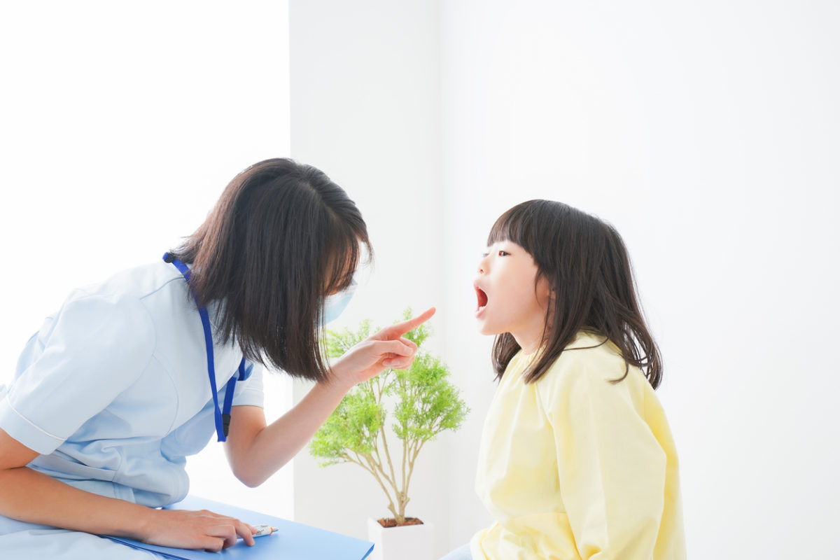 Nurse practitioner with child
