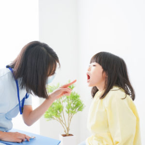 Nurse practitioner with child