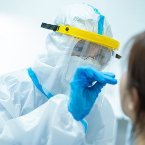 Nurse in full PPE (personal protective equipment) gear..