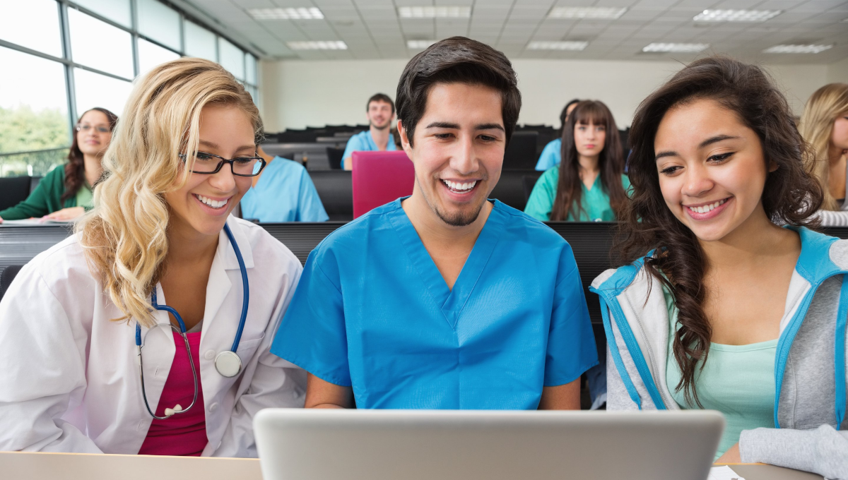 Nursing students look at a computer screen.