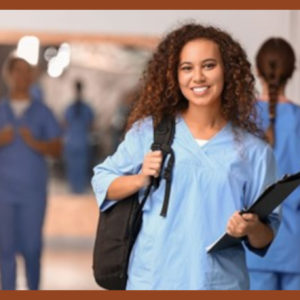 Nursing student in hospital corridor.
