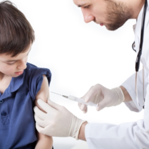 Male pediatric nurse vaccinates a child.