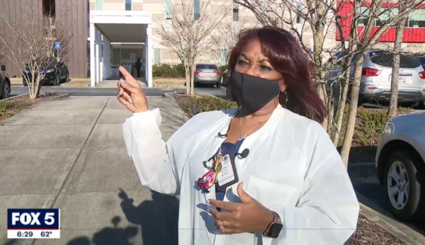 Nurse Evalyn Davis points to delivery entrance.