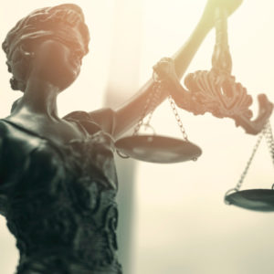 Blind Justice with scales.
