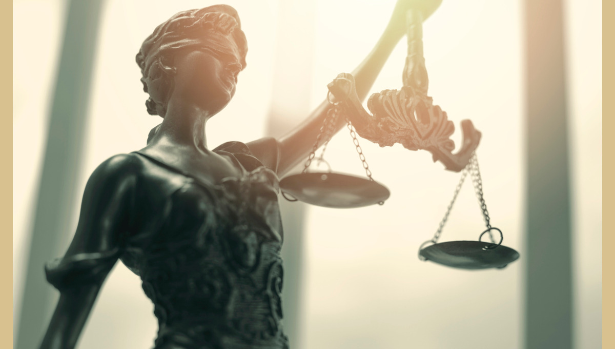 Blind Justice with scales.