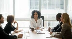 a diverse board of trustees sitting at a conference table