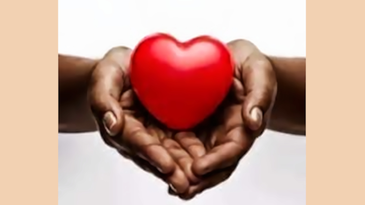 Transplant symbol: Black woman's hands holding a red heart