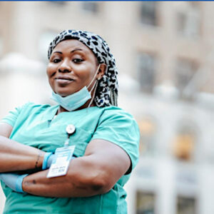 Healthy Black nurse in scrubs.