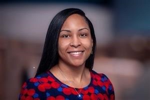 headshot of Michaela Lewis in a red and blue top for pediatric nursing