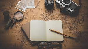 a collage of items including an open notebook