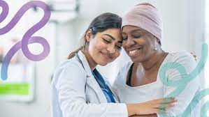 two women with their heads together in a comfort pose in a healthcare setting for a cervical health blog