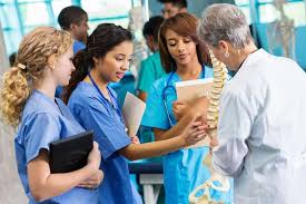 nursing students and faculty members standing and talking