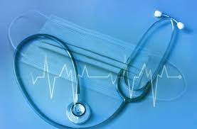 a stethoscope over a face mask and with a graphic heartbeat image for HR week