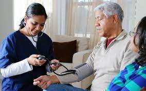 a female nurse careing for a male patient language barrier