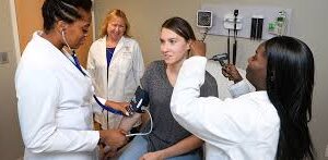 nurse practitioners treating a patient