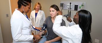 nurse practitioners treating a patient